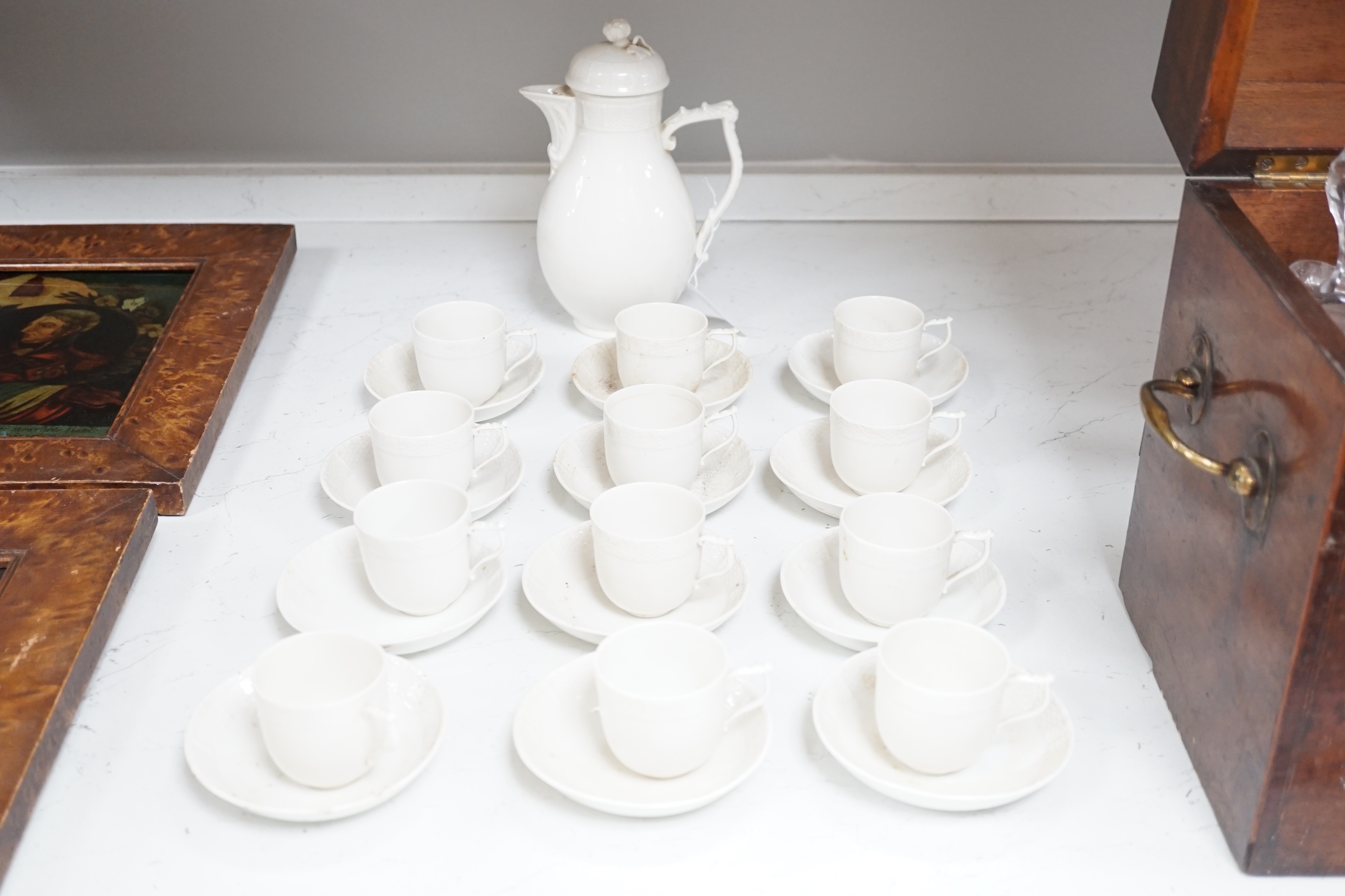 An early 20th century Berlin white glazed porcelain coffee set, tallest 21cm